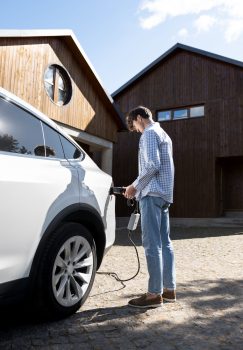 person-taking-care-electric-car